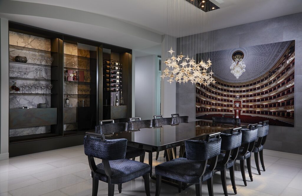 Dining room and illuminated display cabinetry at Bristol Residence