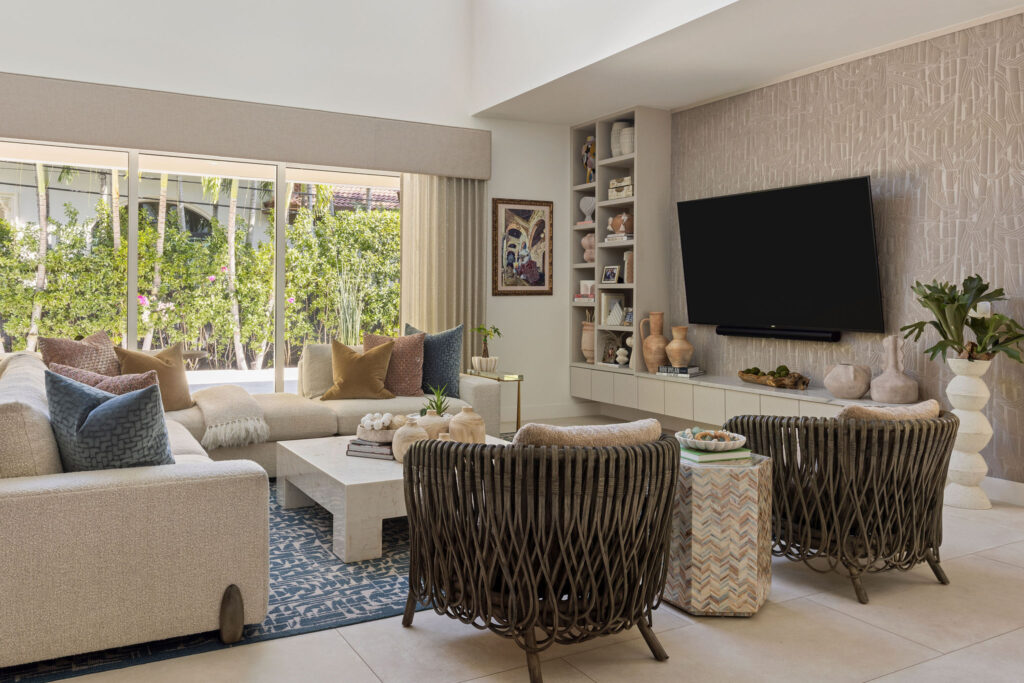 Wolfe Residence living room with layered seating, textiles, and styled shelving